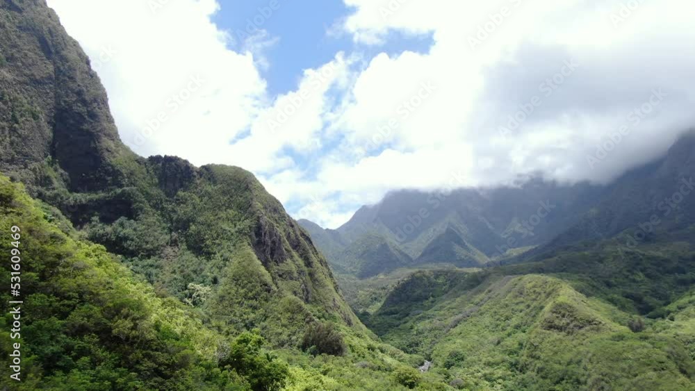 Majestic views of the Iao Valley mountain ranges covered in lush green vegetation. Majestic views of the Iao Valley mountain ranges covered in lush green vegetation.