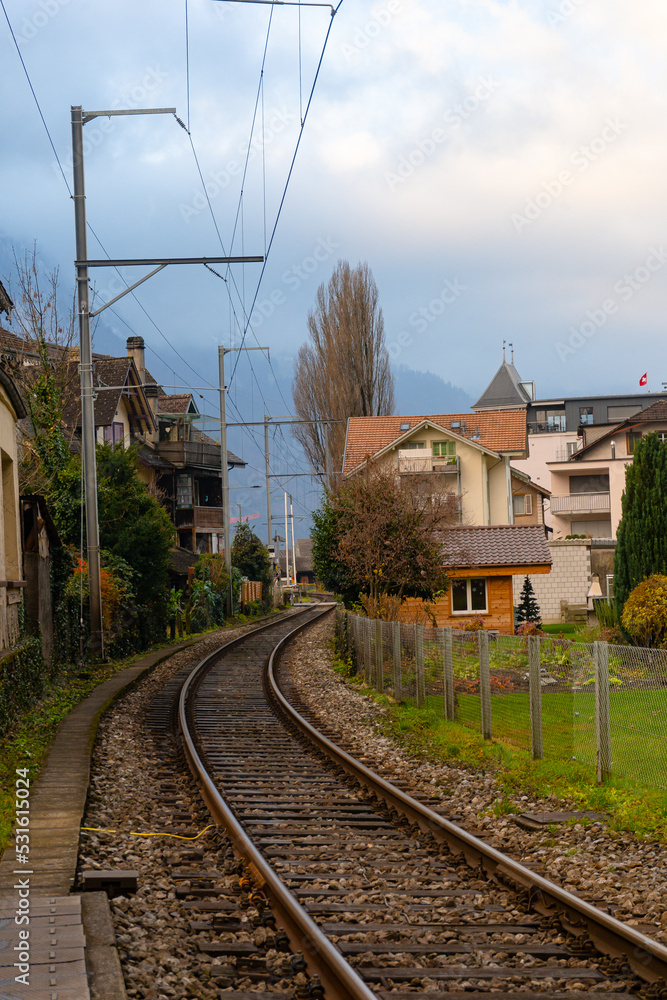 Beautiful railways in Interlaken city , resort town in oberland region , during autumn , winter cloudy day : Interlaken , Switzerland : December 3 , 2019