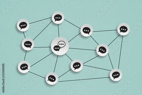 Concept of online communication or social networking.  circle grunge white paper cut with chat icon, linked to each other with lines