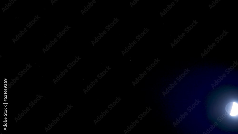 Time lapse of beautiful moon against a blue sky Time lapse of beautiful moon against a blue sky