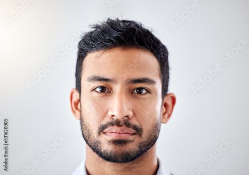 Business man, portrait and serious face expression with studio background for copy space with flare. Corporate person with thinking, focus and doubt facial look for dilemma or concentration.