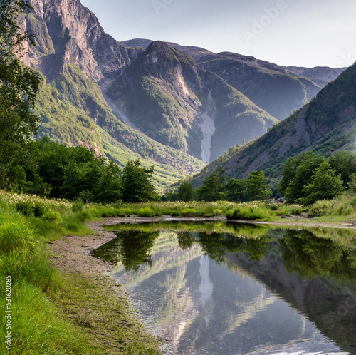 Beautiful summer landscape, Scandinavia, Norway. The mountains are reflected in the lake's water