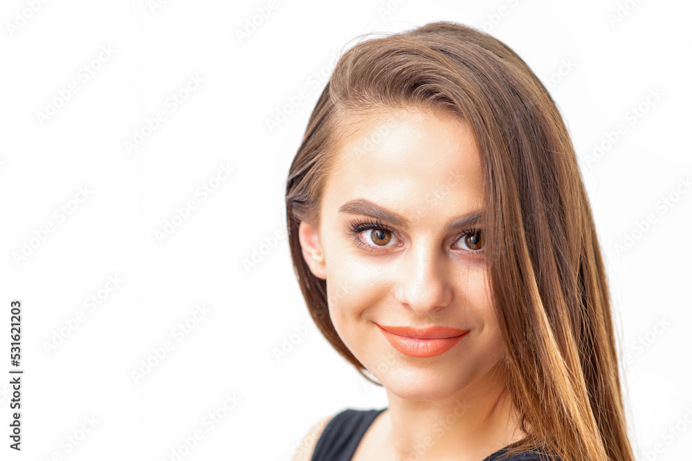 Portrait of a beautiful young caucasian smiling brunette woman with long straight hair standing and looking at the camera on white background Portrait of a beautiful young caucasian smiling brunette woman with long straight hair standing and looking at the camera on white background