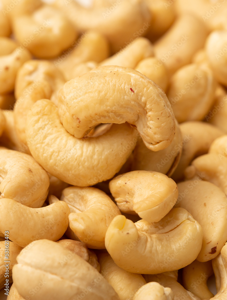 Cashew nuts as a background, top view. Cashew isolated on white background. Healthy foods. Cashew nuts as a background, top view. Cashew isolated on white background. Healthy foods.