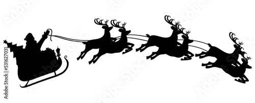 Santa claus on sleigh full of gifts and reindeers photo