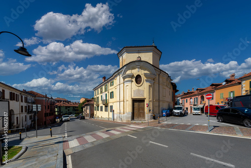 Fossano, Piedmont, Italy - September 09, 2022: Via Marconi with the old church of San Antonio Abate (st Anthony Abbot) in the district of Sant'Antonio
