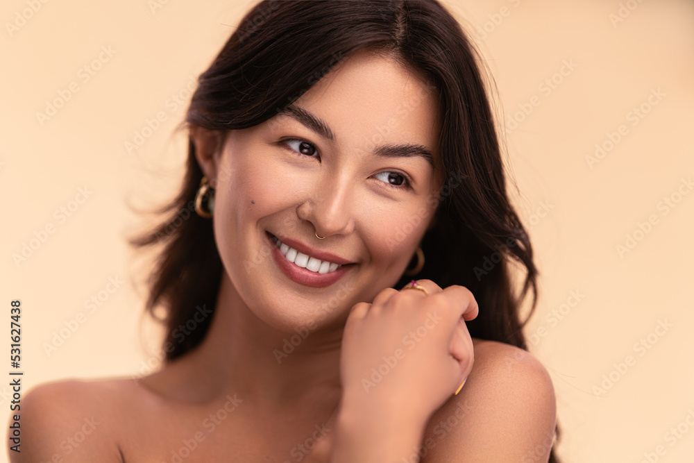 Happy female with perfect skin smiling in studio Happy female with perfect skin smiling in studio