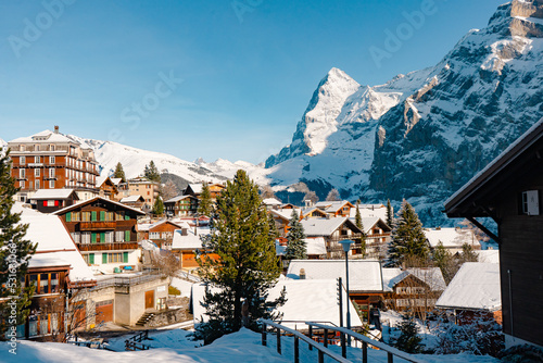 Murren , Swiss mountain village near Schilthorn  and Lauterbrunnen during winter sunny day : Murren , Switzerland : December 3 , 2019 photo