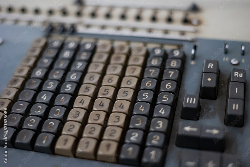 Old calculating machine. Close-up of an old analog calculating machine. Historical equipment to calculate numbers. Old calculating machine. Close-up of an old analog calculating machine. Historical equipment to calculate numbers.