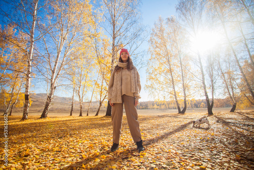 Young woman in the autumn weather in warm clothes and hats © Tatyana Gladskih