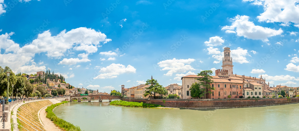 Panorama of the Ponte Pietra bridge and the city of Verona on the banks of the river with historical buildings and towers, Italy, Europe