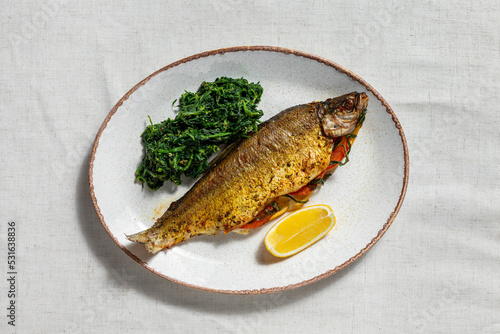 Golden trout baked with tomatoes