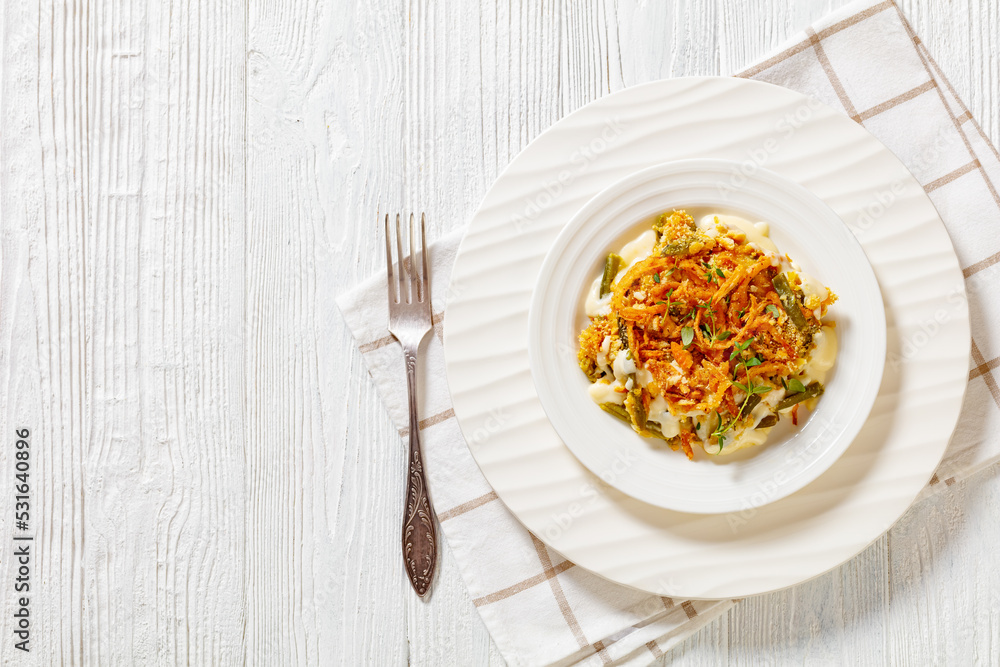 cheesy green bean casserole on plate, top view cheesy green bean casserole on plate, top view