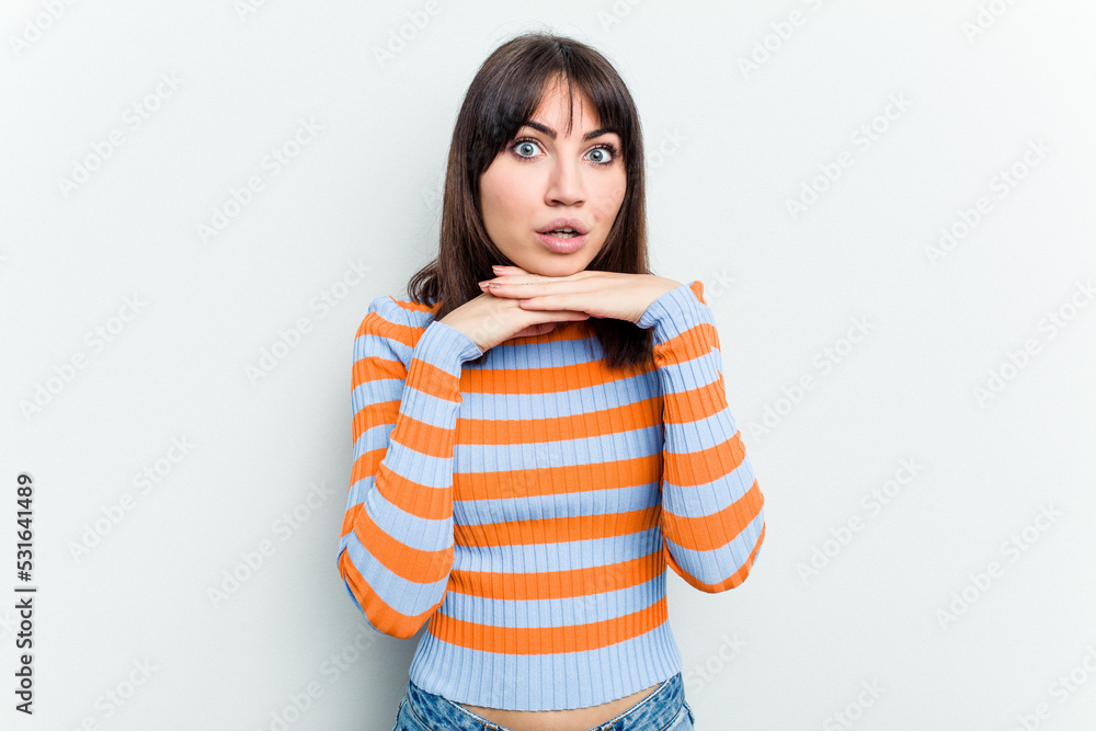 Young caucasian woman isolated on white background praying for luck, amazed and opening mouth looking to front. Young caucasian woman isolated on white background praying for luck, amazed and opening mouth looking to front.