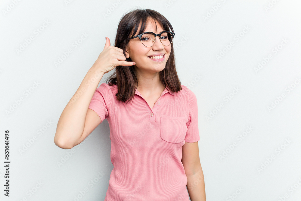 Young caucasian woman isolated on white background showing a mobile phone call gesture with fingers. Young caucasian woman isolated on white background showing a mobile phone call gesture with fingers.