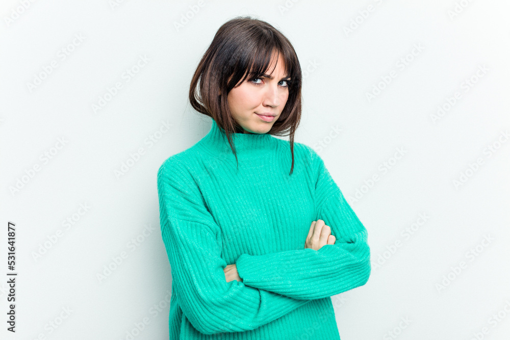 Young caucasian woman isolated on white background suspicious, uncertain, examining you. Young caucasian woman isolated on white background suspicious, uncertain, examining you.