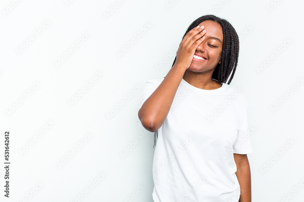 Young African American woman isolated on white background laughing happy, carefree, natural emotion. Young African American woman isolated on white background laughing happy, carefree, natural emotion.