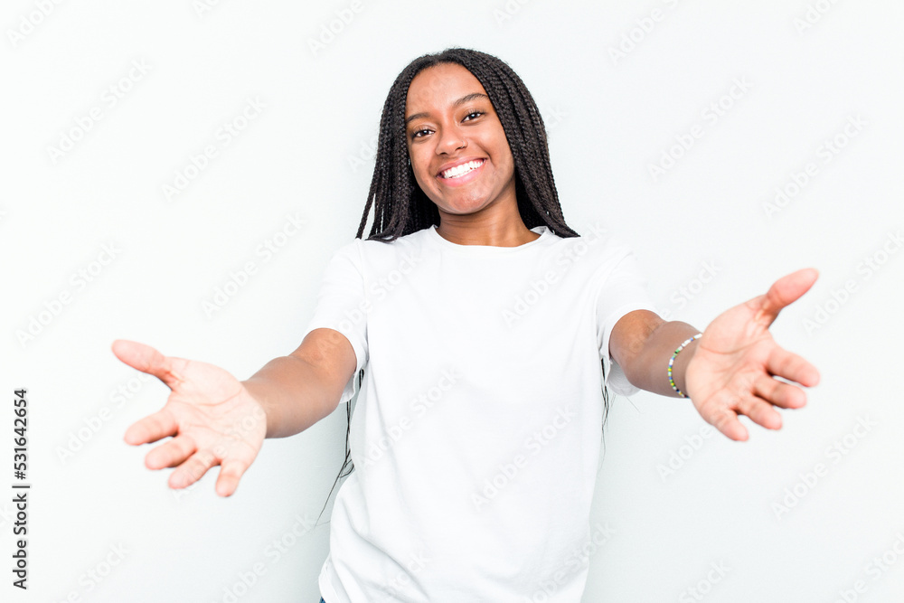 Young African American woman isolated on white background showing a welcome expression. Young African American woman isolated on white background showing a welcome expression.