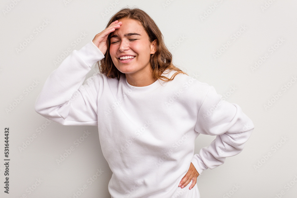 Young caucasian woman isolated on blue background joyful laughing a lot. Happiness concept. Young caucasian woman isolated on blue background joyful laughing a lot. Happiness concept.