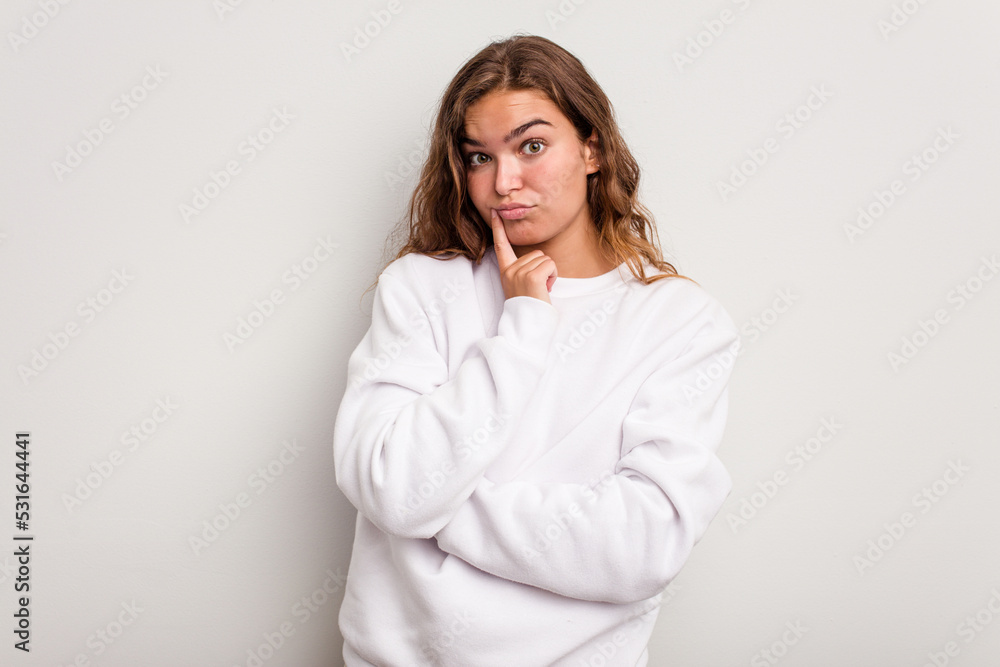 Young caucasian woman isolated on blue background contemplating, planning a strategy, thinking about the way of a business. Young caucasian woman isolated on blue background contemplating, planning a strategy, thinking about the way of a business.