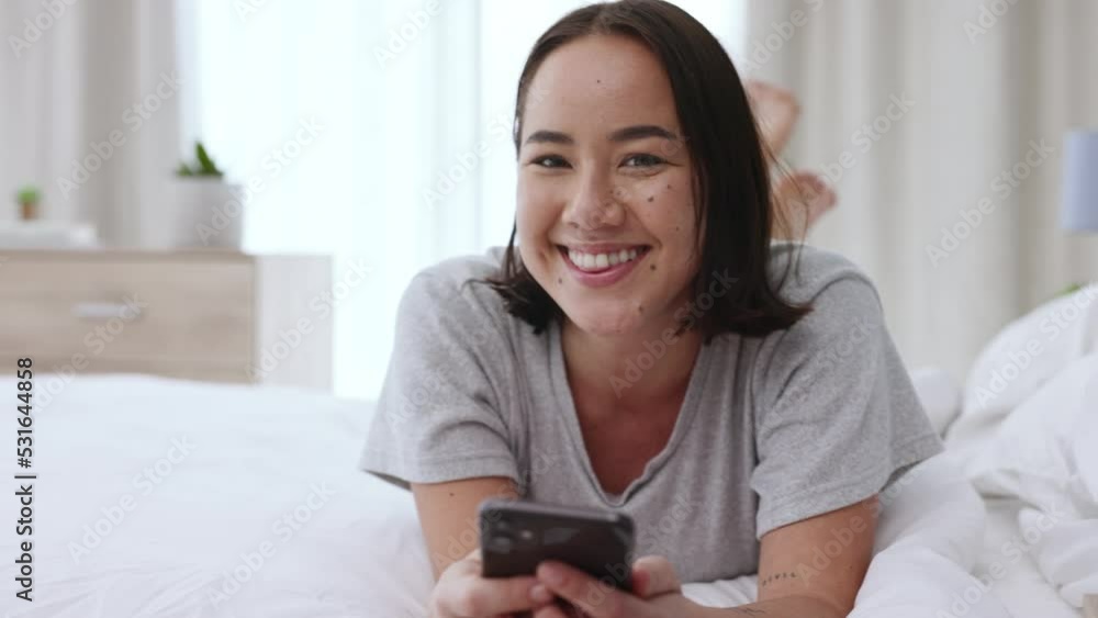 Asian, relax woman with phone on social media or internet with technology, digital and smartphone in bed at home. Happy girl, smile and communication, network and contact us on mobile cellphone. Asian, relax woman with phone on social media or internet with technology, digital and smartphone in bed at home. Happy girl, smile and communication, network and contact us on mobile cellphone.