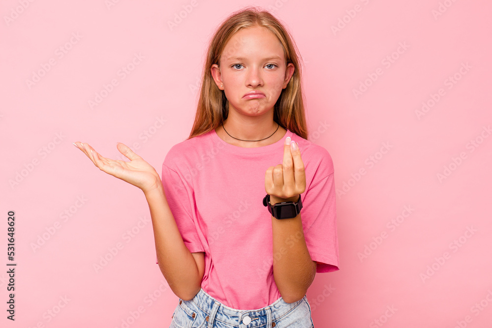 Caucasian teen girl isolated on pink background showing that she has no money.