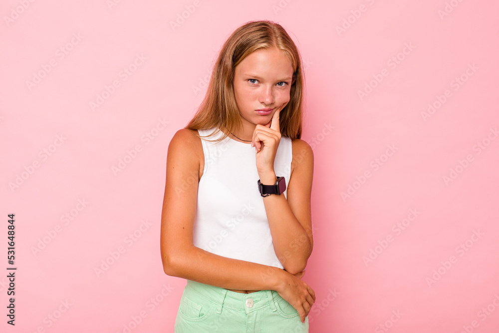 Caucasian teen girl isolated on pink background contemplating, planning a strategy, thinking about the way of a business. Caucasian teen girl isolated on pink background contemplating, planning a strategy, thinking about the way of a business.