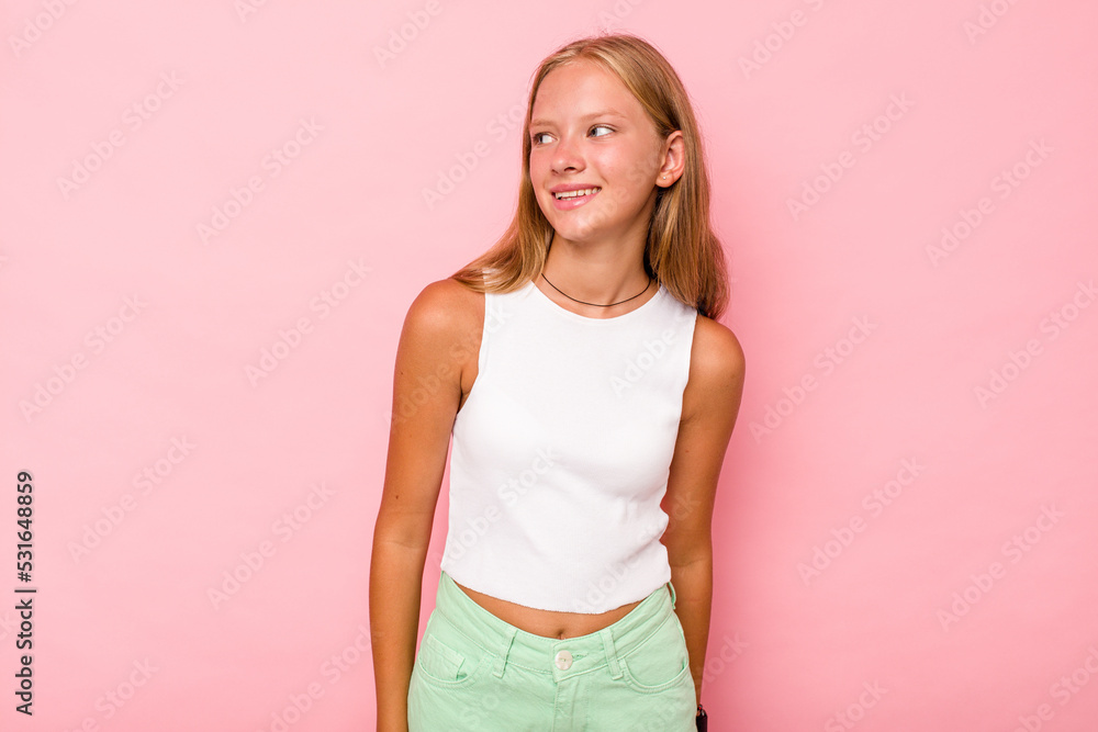 Fototapeta premium Caucasian teen girl isolated on pink background relaxed and happy laughing, neck stretched showing teeth.