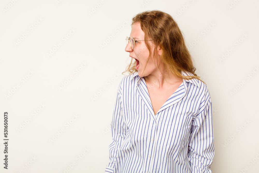 Young caucasian woman isolated on white background shouting very angry, rage concept, frustrated. Young caucasian woman isolated on white background shouting very angry, rage concept, frustrated.
