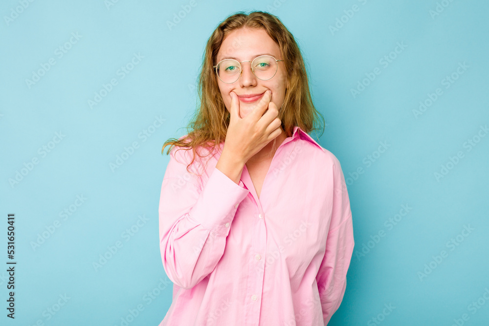 Young caucasian woman isolated on blue background doubting between two options. Young caucasian woman isolated on blue background doubting between two options.