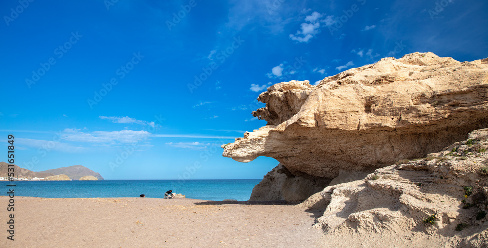 beach and rock with blue sky
