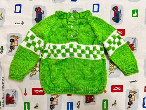 One with the green sweater. Baby sweater. Toddler sweater. Hand knitted sweater. 
