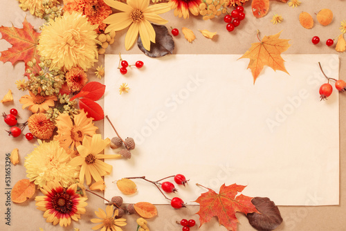 autumn flowers and leaves on  paper background
