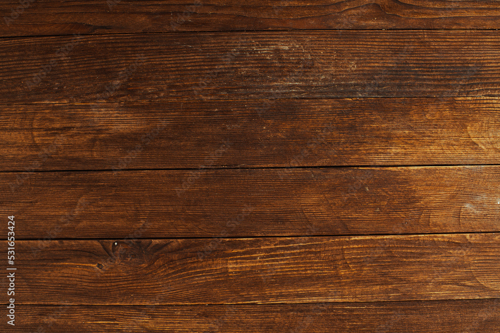 Naklejka premium Vintage brown wood background texture with knots and nail holes. Old painted wood wall. Brown abstract background. Vintage wooden dark horizontal boards. Front view with copy space. Background for des