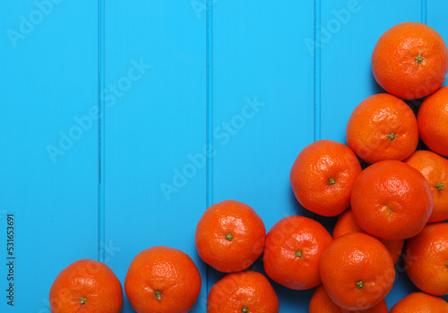 Tangerine on wood table background