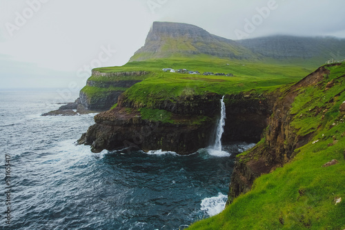 waterfall and cliffs above the sea 