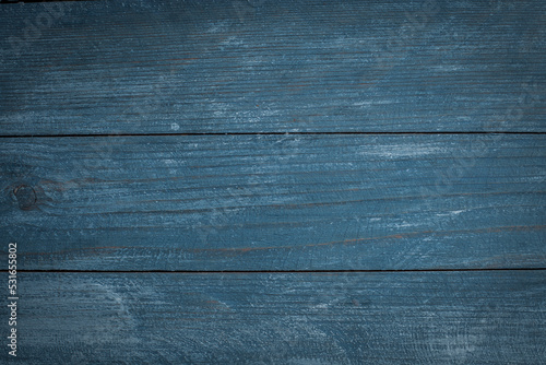  Vintage blue wood background texture with knots and nail holes. Old painted wood wall. Blue abstract background. Vintage wooden dark blue horizontal boards. Front view with copy space. 