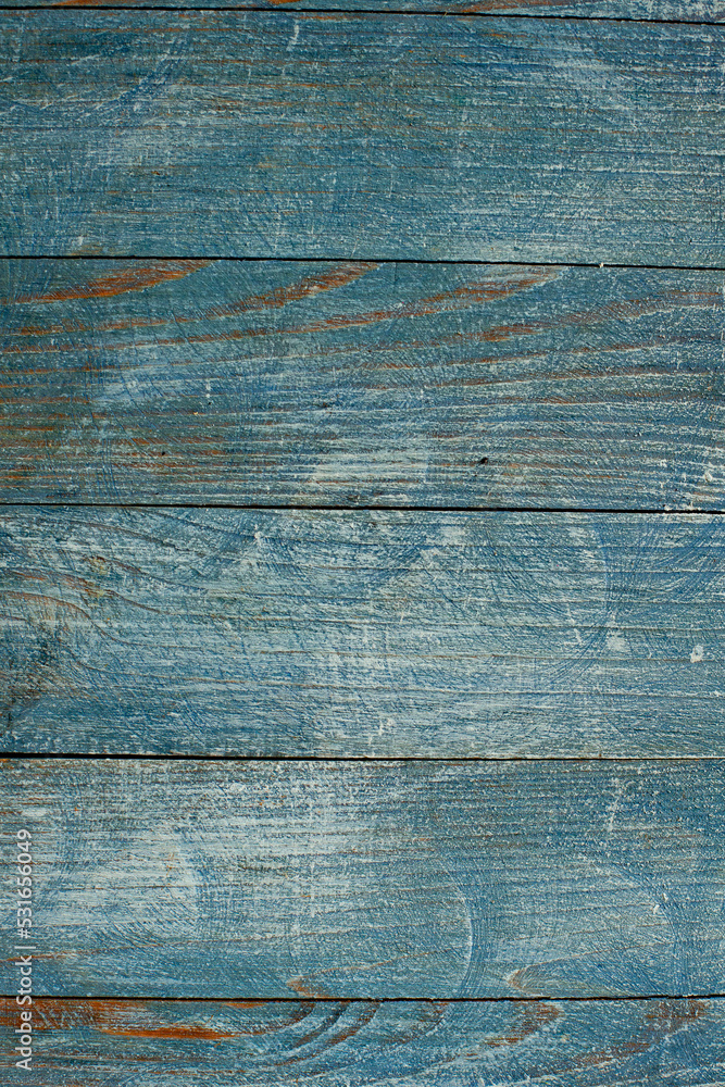 Fototapeta premium Vintage blue wood background texture with knots and nail holes. Old painted wood wall. Blue abstract background. Vintage wooden dark blue horizontal boards. Front view with copy space. 