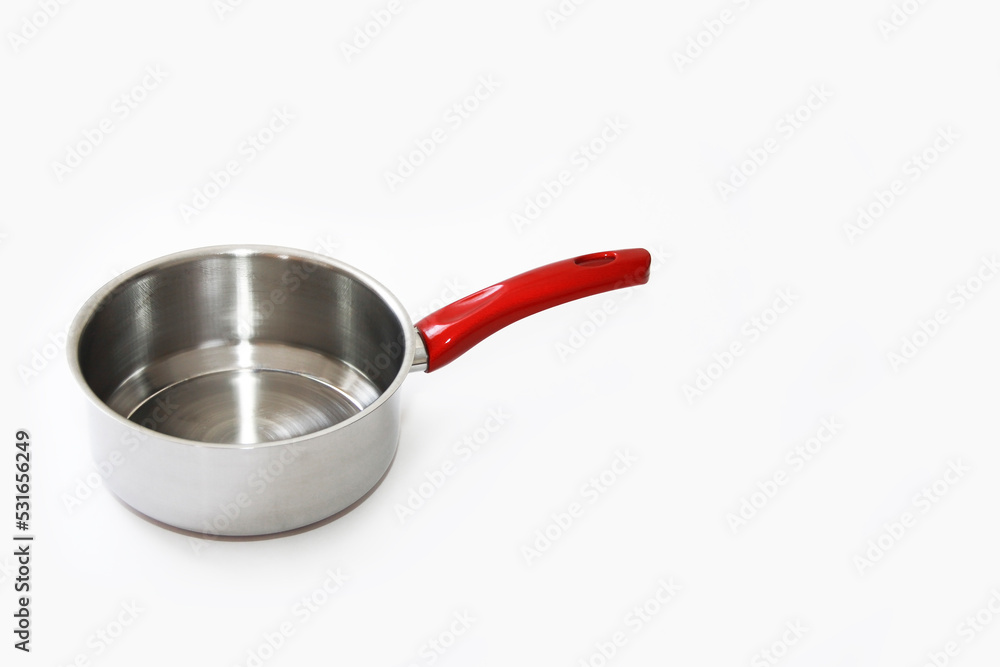 metal grey ladle with red handle, for cooking, on a white background, isolate metal grey ladle with red handle, for cooking, on a white background, isolate