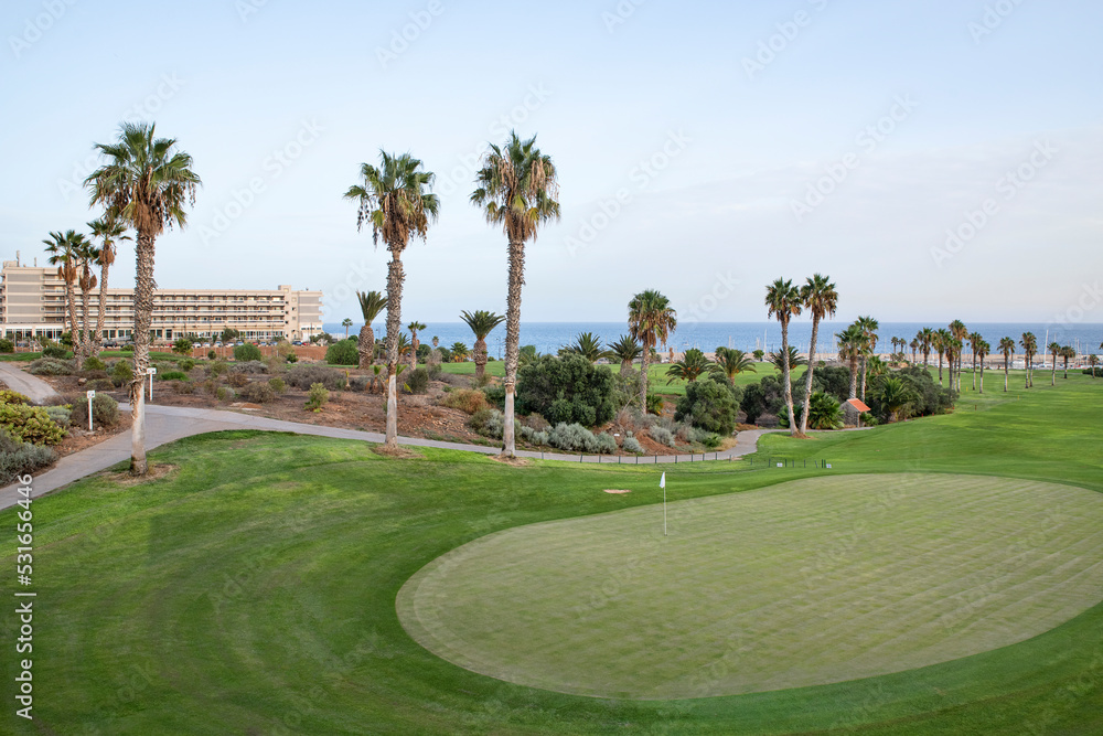 Afternoon to evening mellow light over the immaculate greens and fairways at the popular coastal golf course, Amarilla Golf, San Miguel de Abona, Tenerife, Canary Islands, Spain