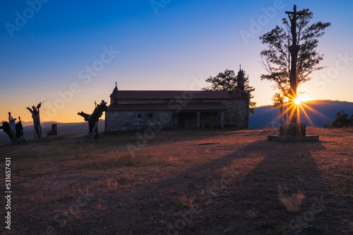 Sunset over the chapel of the sweet name of Jesus, near Ponteareas, Galicia, Spain.