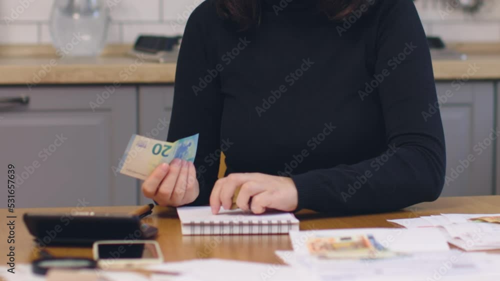 female in black sit kitchen count coins money hold paper banknotes calculating payments. pay home utilities family budget concept. sadness depression salary high prices cost of living bankruptcy female in black sit kitchen count coins money hold paper banknotes calculating payments. pay home utilities family budget concept. sadness depression salary high prices cost of living bankruptcy