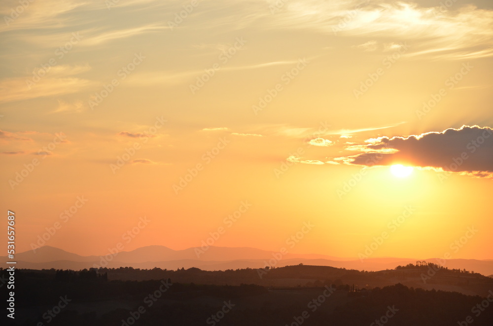 Sunset falling over the beautiful countryside and town of Montepulciano in Tuscany on a bright summer day Sunset falling over the beautiful countryside and town of Montepulciano in Tuscany on a bright summer day