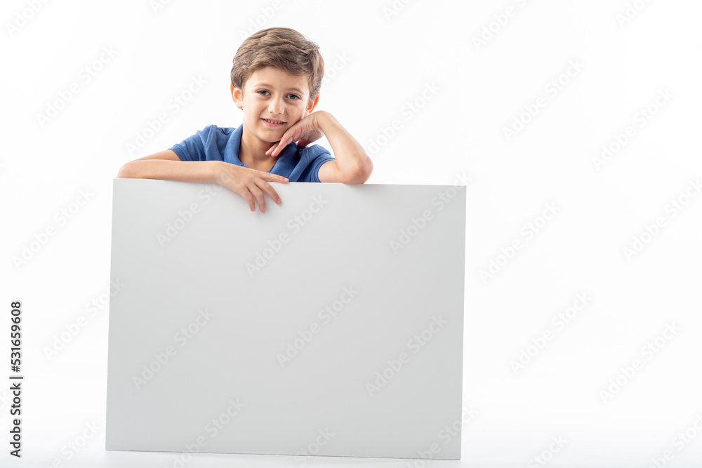 Funny child showing a white advertising poster with space for text. Funny child showing a white advertising poster with space for text.