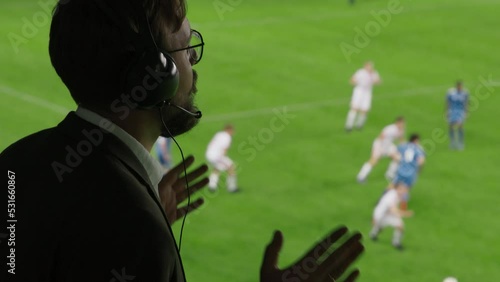 Side View Sports Commentator Analysing Soccer Match, Live Game. Silhouette of Announcer with Football Stadium and Field Before Him Commenting on the Seasons Best Moments, Talking about Top Players photo
