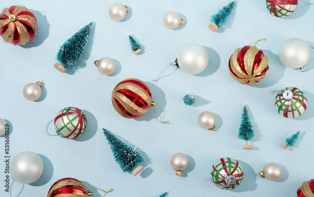 red and white shiny christmas balls on blue pastel backgroud, pattern red and white shiny christmas balls on blue pastel backgroud, pattern