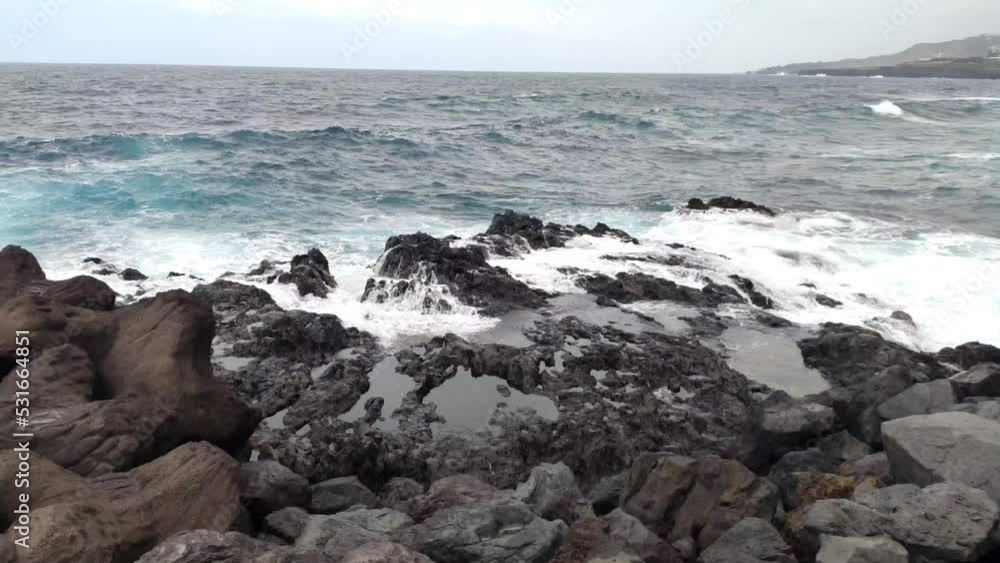 Rocky ocean shore and waves. Garachico. Tenerife. Canary Islands. Spain. Rocky ocean shore and waves. Garachico. Tenerife. Canary Islands. Spain.