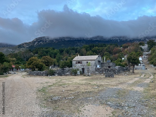 Old stone cabin on Velebit mountain in Croatia photo