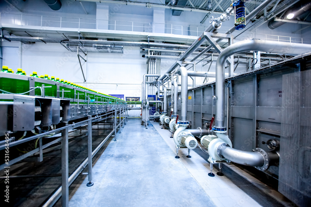 Equipment on beverage factory. Industrial drink production Equipment on beverage factory. Industrial drink production