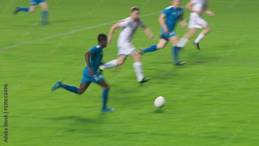 Soccer Football Championship: Blue Team Forward Attacks, Scores Goal, Win the Match, Players Happy, Celebrate Victory, Win Major League Cup. Sport Channel Broadcast Television Playback. Tracking Shot Soccer Football Championship: Blue Team Forward Attacks, Scores Goal, Win the Match, Players Happy, Celebrate Victory, Win Major League Cup. Sport Channel Broadcast Television Playback. Tracking Shot